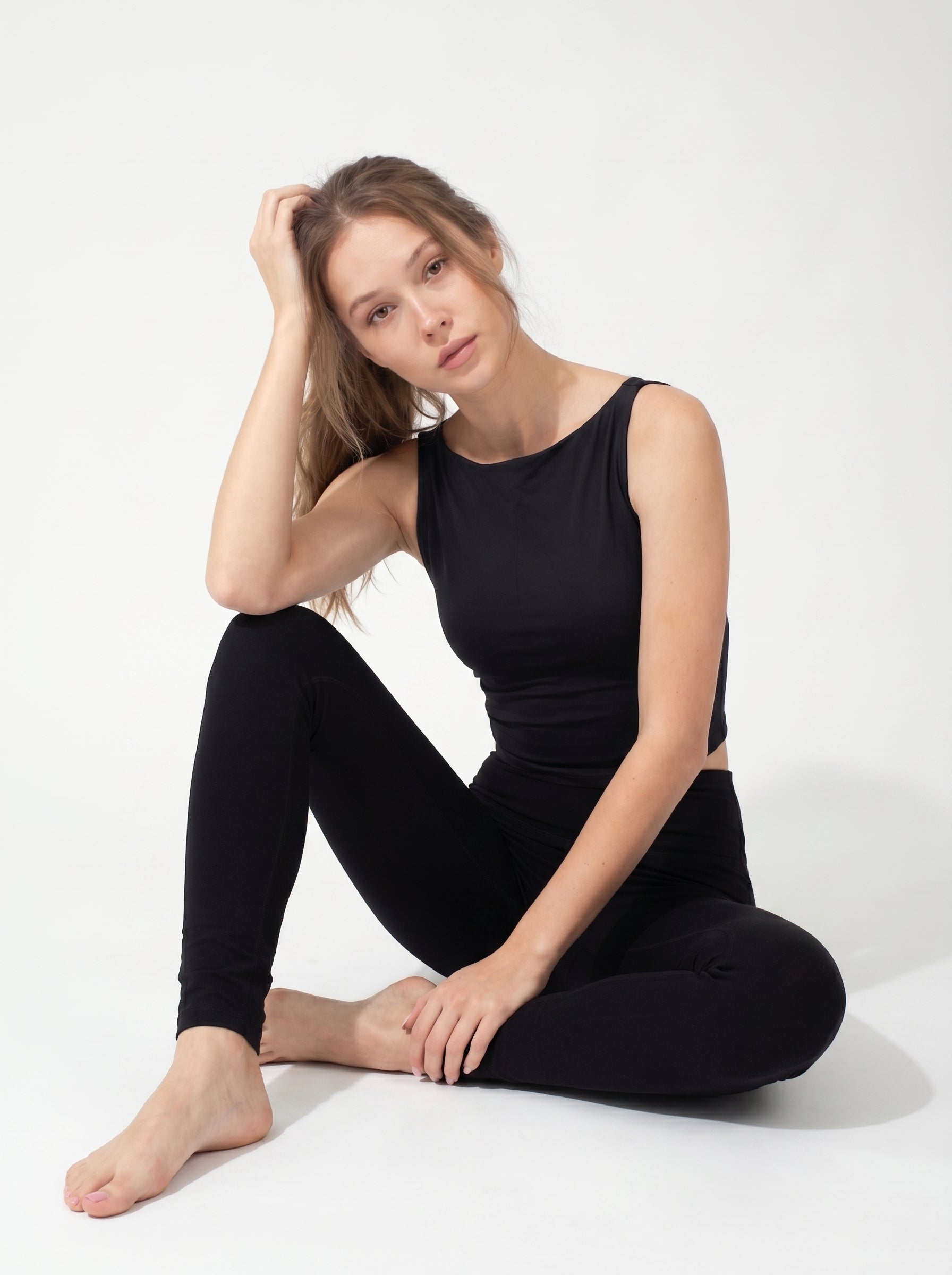 Maya Vida black set seated editorial